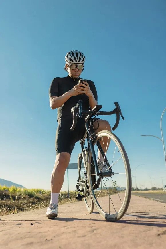 A reviewer, a cyclist at the roadside.